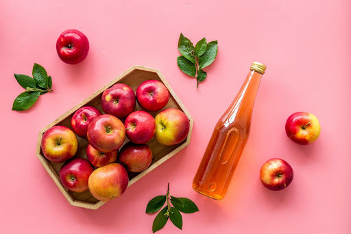 Bird's eye view of ingredients on a table making apple cider vinegar